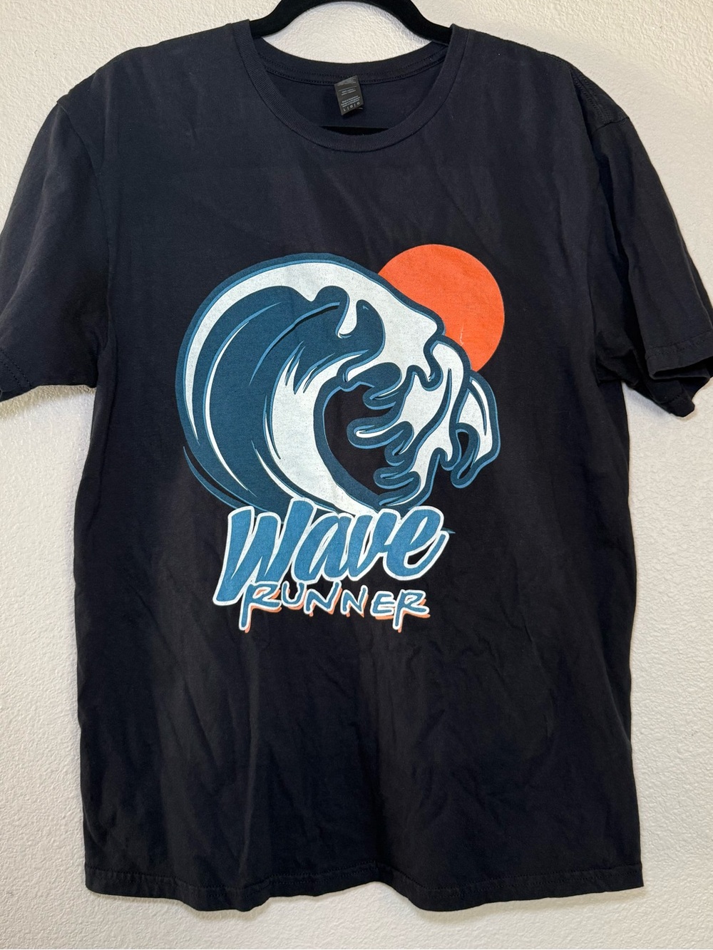 Source Unknown Black Tee with Blue Wave and Orange Sun Graphic
